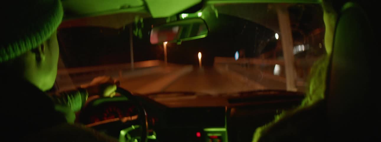 Two people are riding in a car
