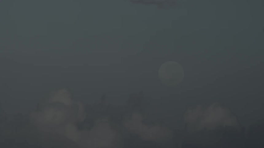 The moon in a dark cloudy sky