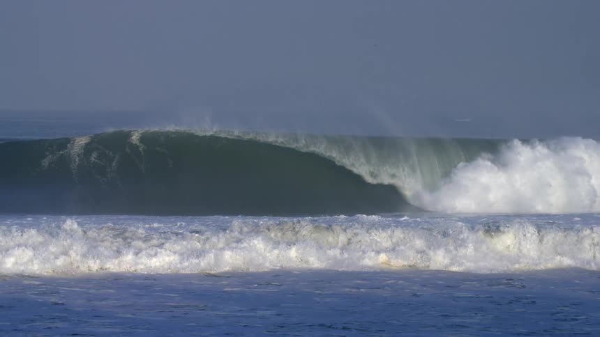 The waves crash in the ocean