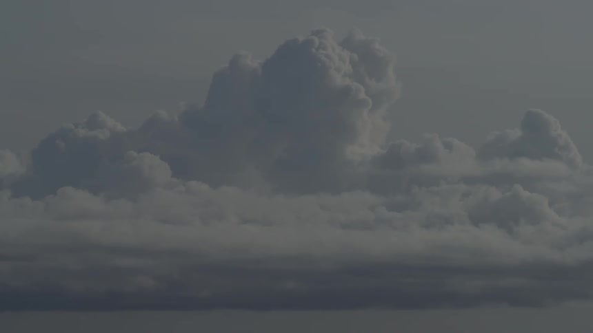 Clouds float in the sky during daylight
