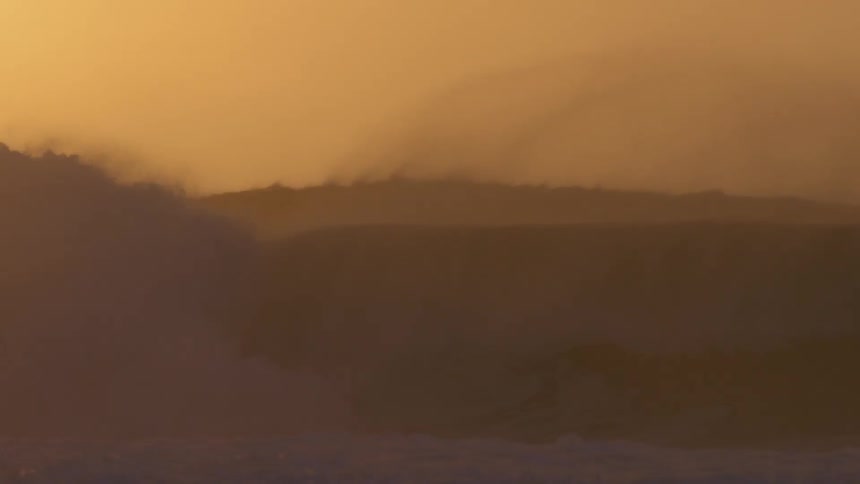 Waves crashing in the fog