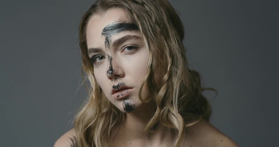 Woman with black staining her face