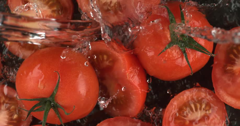 Tomatoes being splashed with water