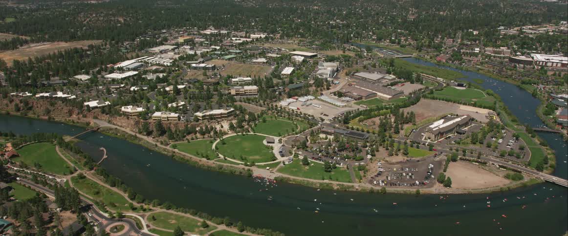 A city and neighborhoods are building around a horseshoe shaped river