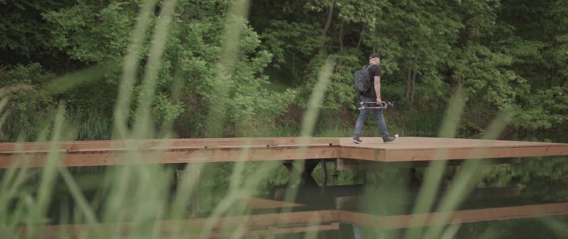 A man walks through the forest