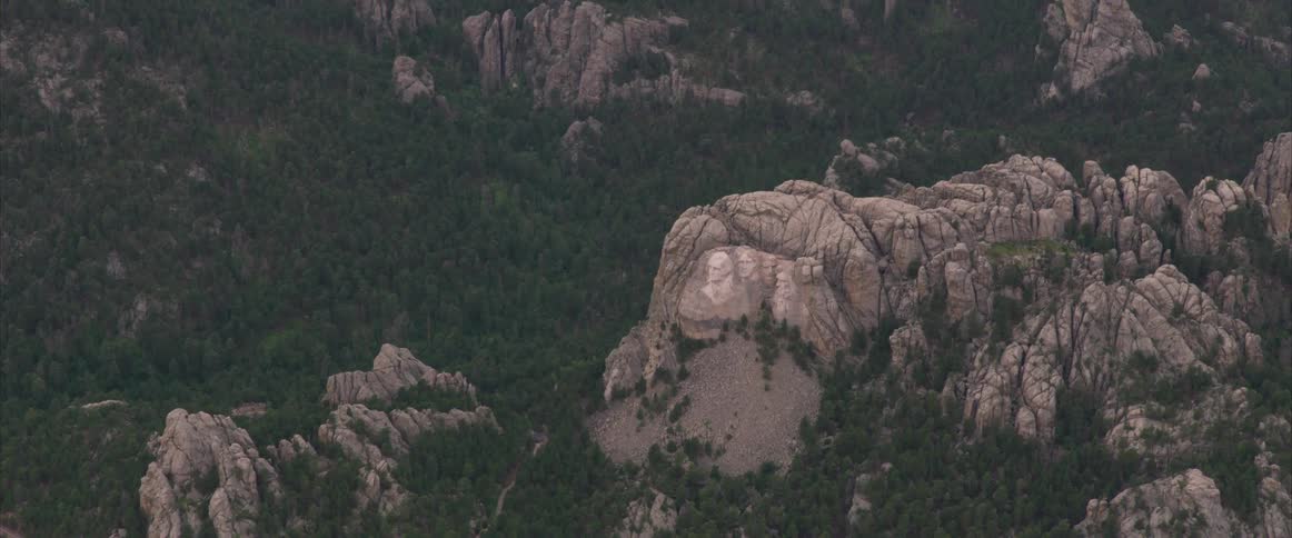 Mount rushmore in the distance of other hills