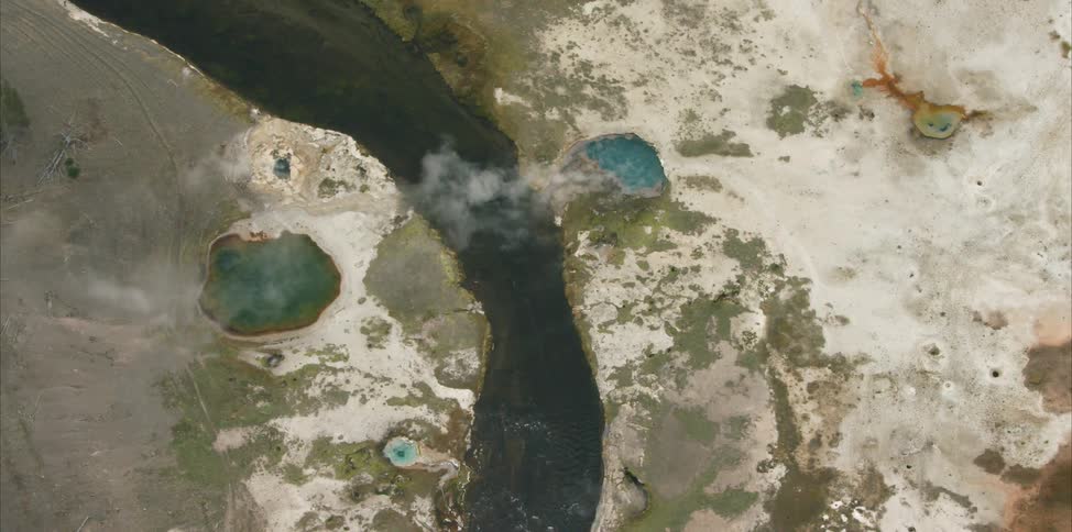 Steam rises from a geothermal pool