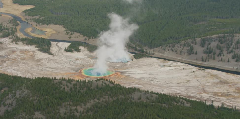 Steam rises from a hot spring