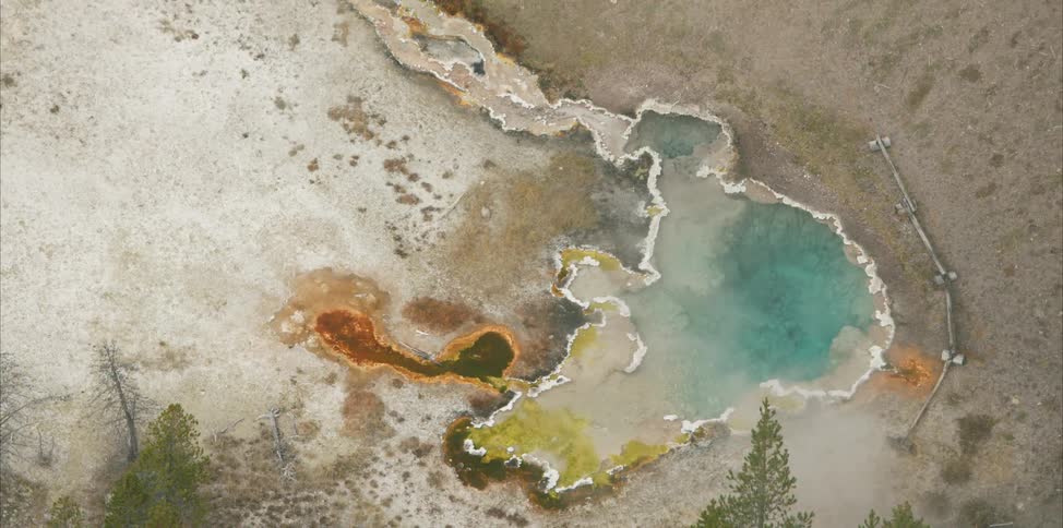 The hot spring is at the bottom of the hill