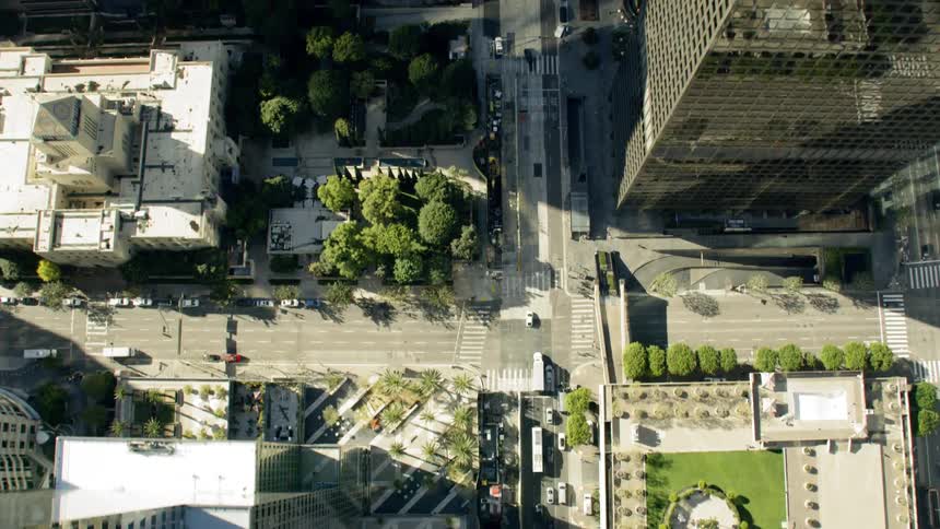 Flying over a city that has tall buildings