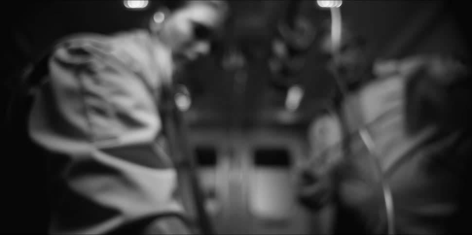 Emts work on a patient in the back of an ambulance