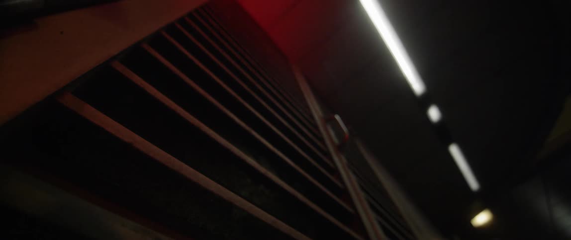 A red light flashes against the door of a storage unit