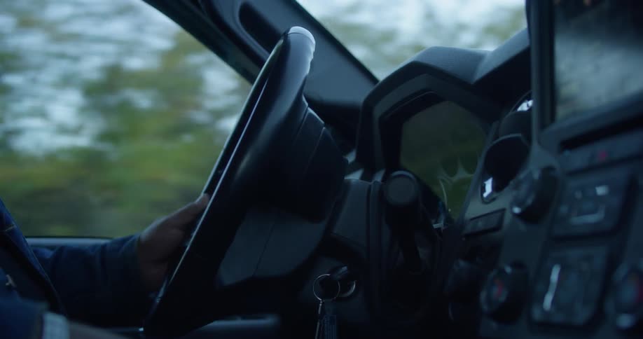 A man drives a car