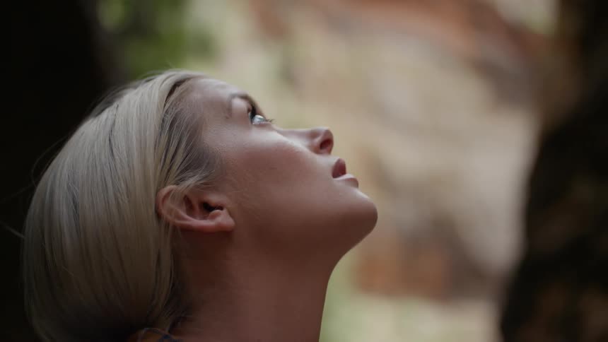 A woman stares up