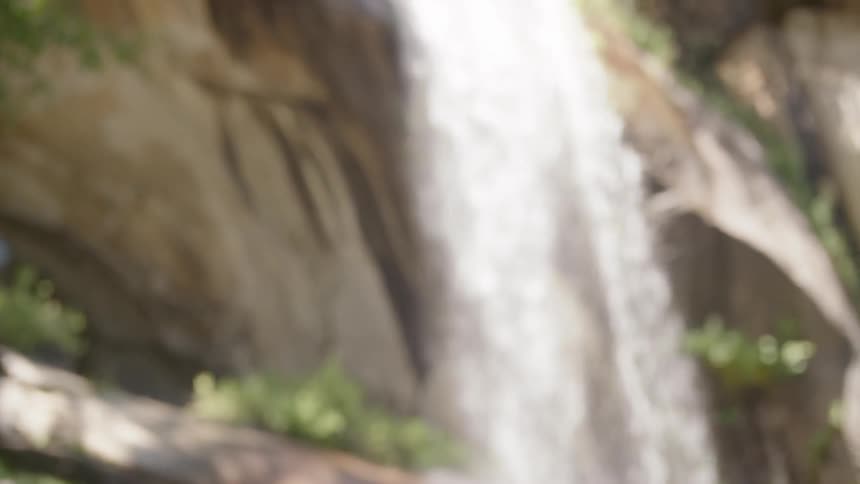 Male observing a waterfall from a distance