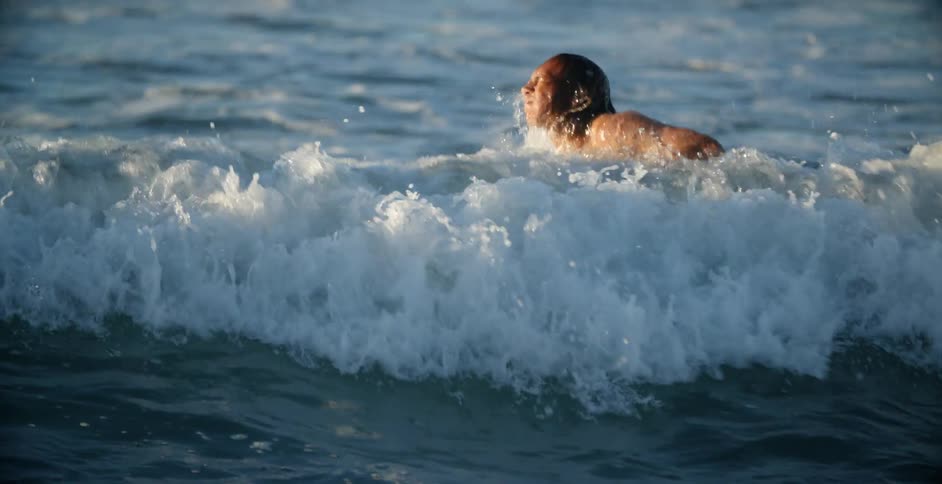 A man is surfing