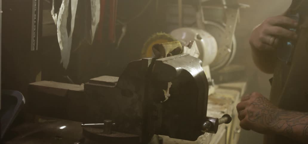A young man works with tools
