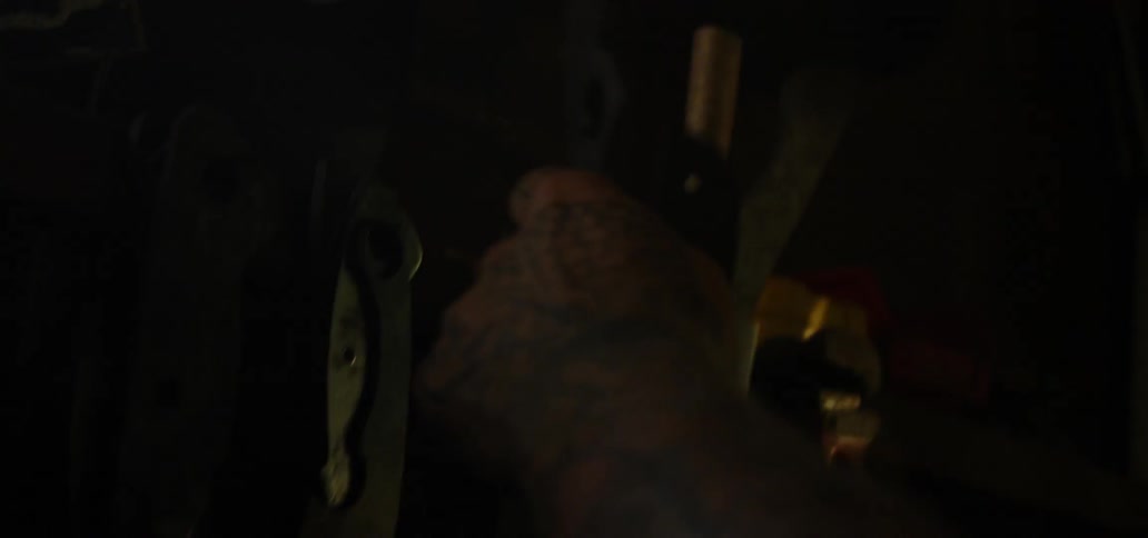 A man grabs tools