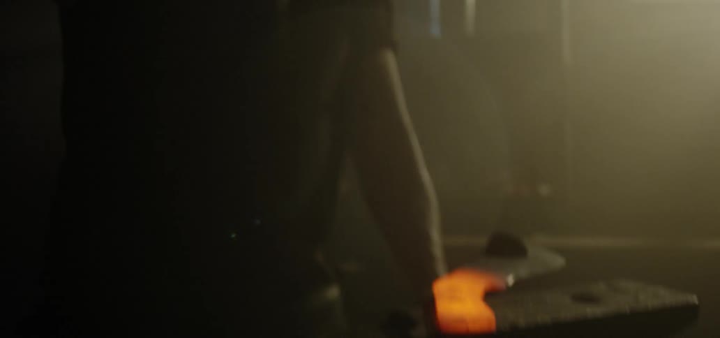 A man bangs on hot metal