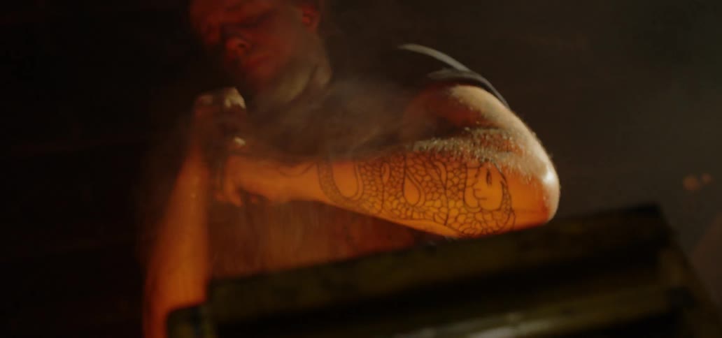 A man is working in a blacksmith shop