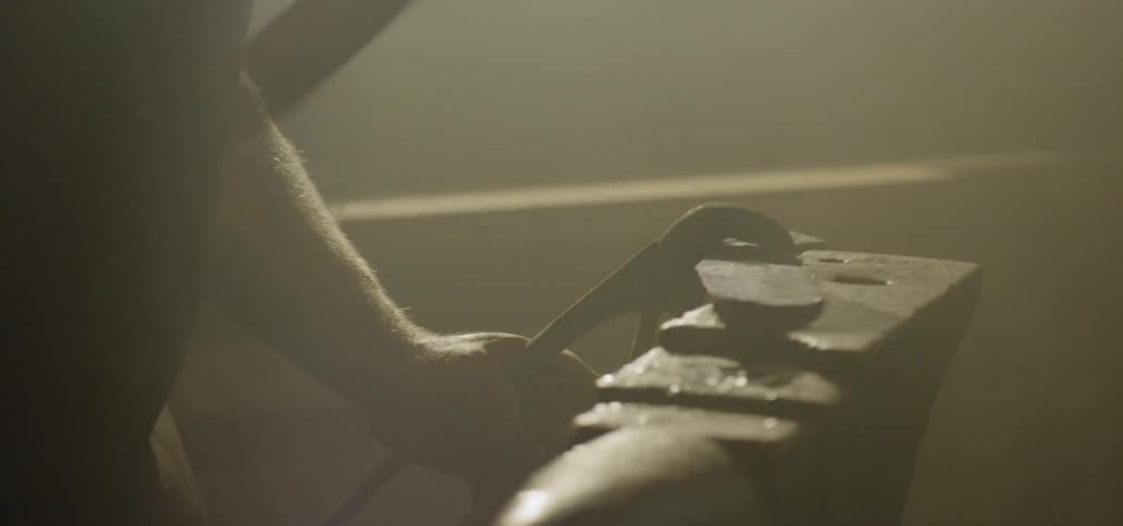 A man hammers hot metal