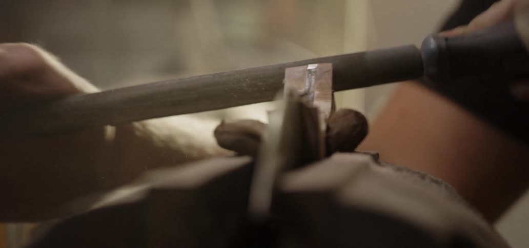 A man files the tool