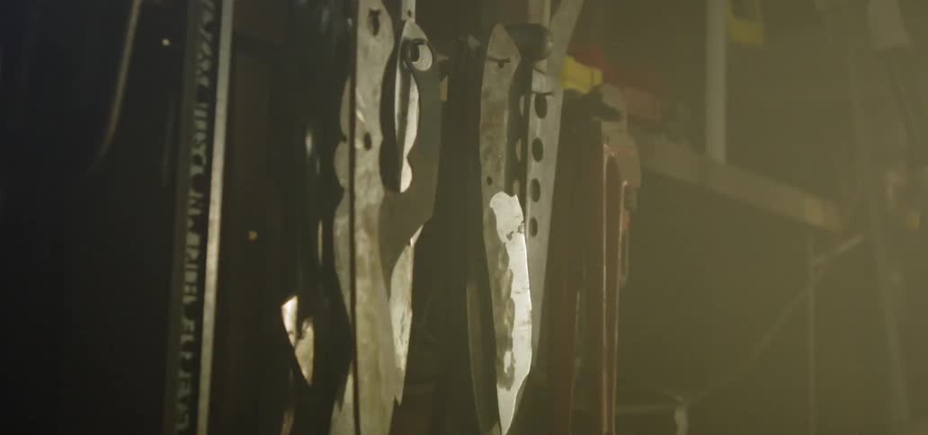 Tools rattle on the wall