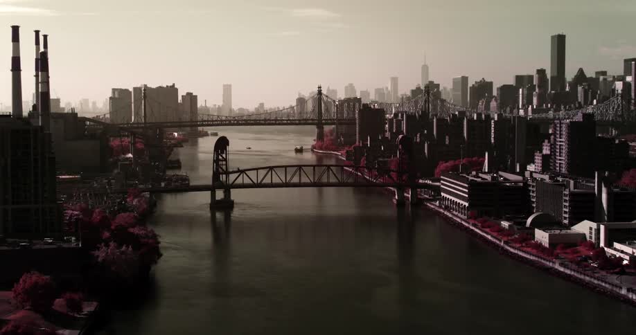 A bridge connects two urban areas separated by a body of water