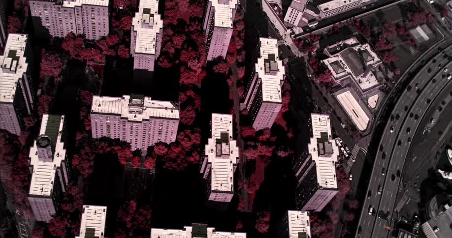 A large metropolitan city is filled with countless tall buildings and a busy freeway