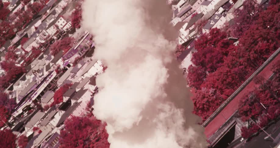 Smoke billows from a factory in the city