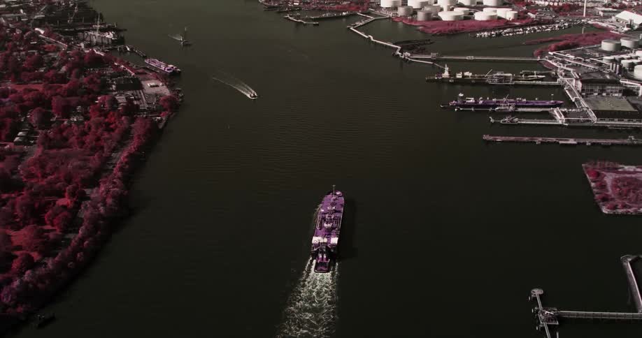 A large ship traveling down a waterway