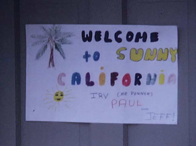 A handmade welcome sign on a door