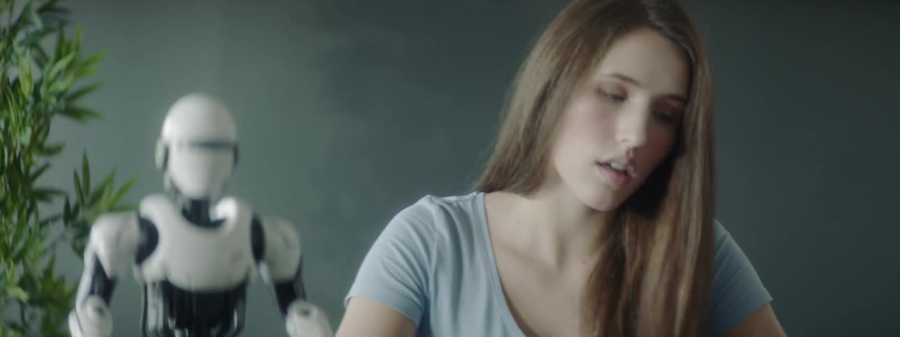 A woman is reading the instructions for her robot
