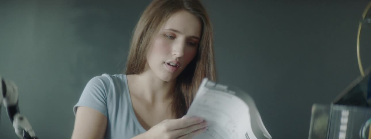 Woman reads through instructions at table