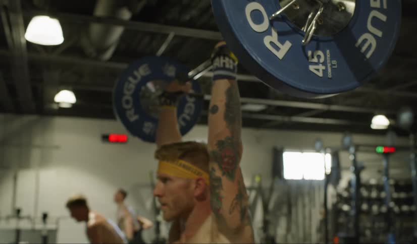 Men lifting barbells for exercise