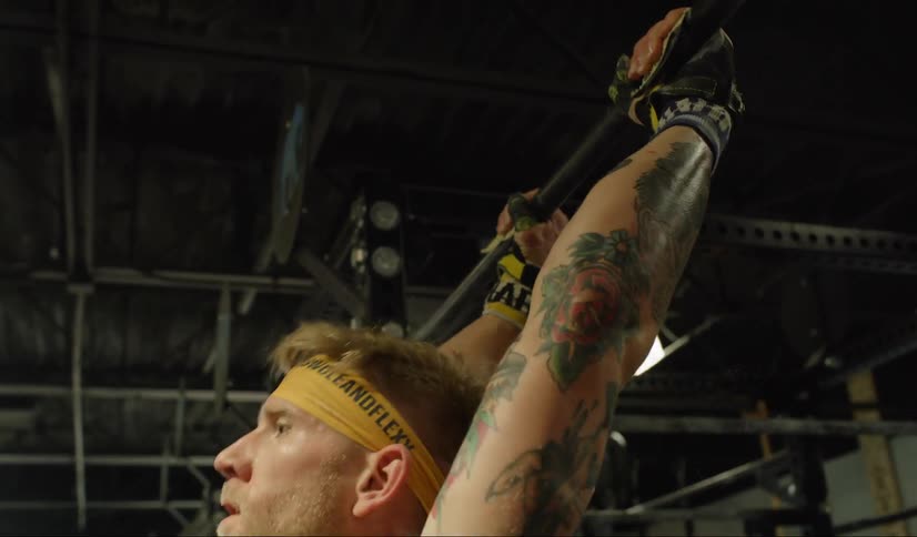 Men are working out in a gym