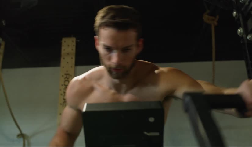 A man is exercising on a machine