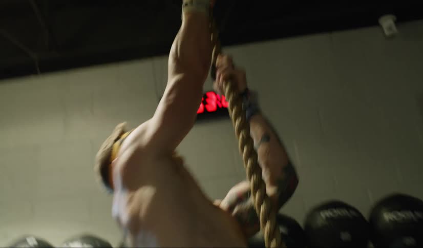 A man climbs a rope
