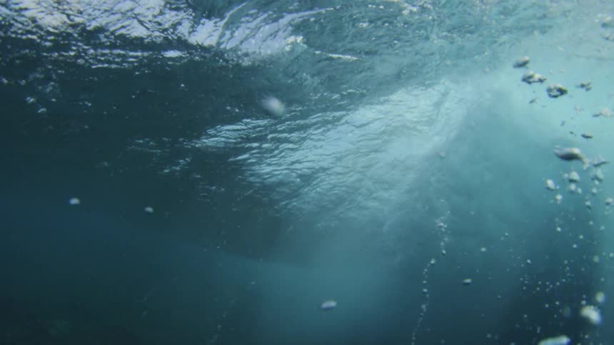 Close up underwater view of wave forming in the ocean