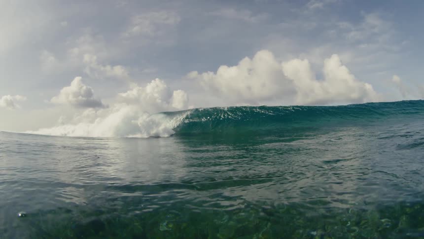 A large wave breaking on a cloudy day