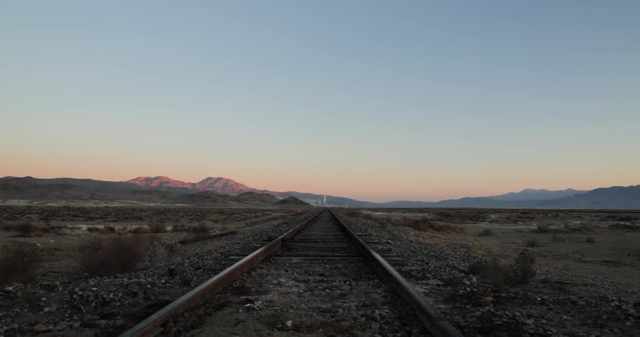 Abandoned railroad tracks in the middle of a desert