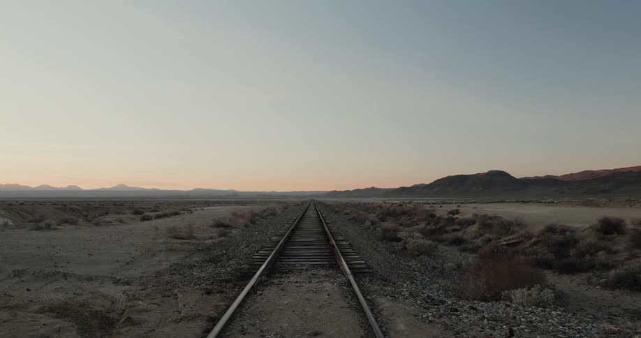 Abandoned train tracks going off into the horizon