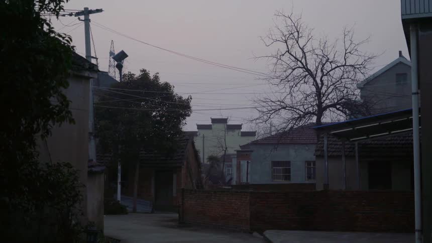 A neighborhood is dimly lit