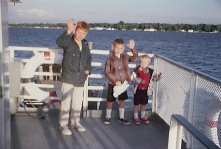 Three boys on a boat