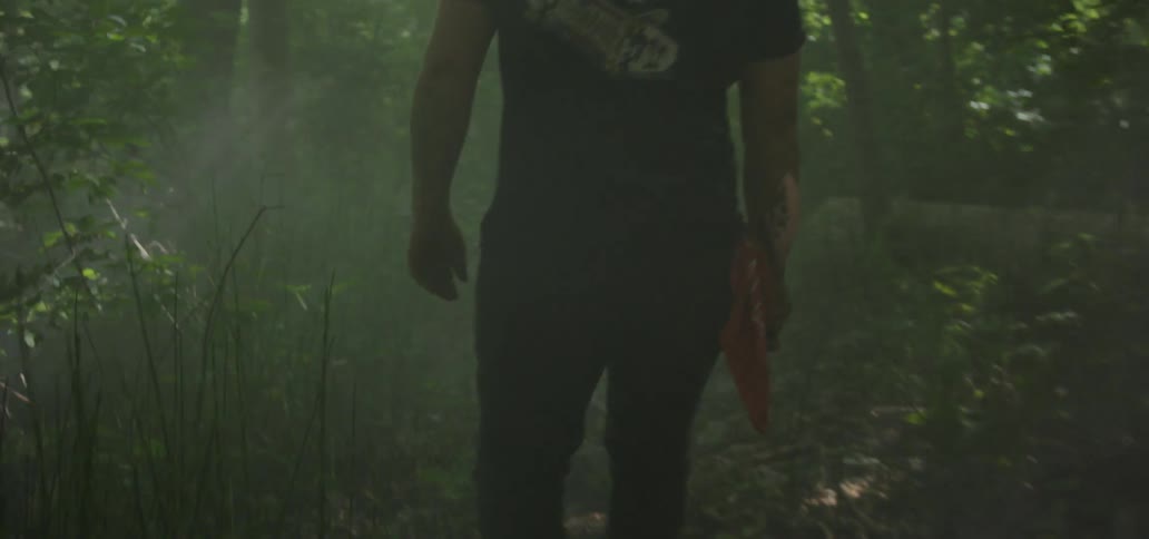 A man walks through the woods