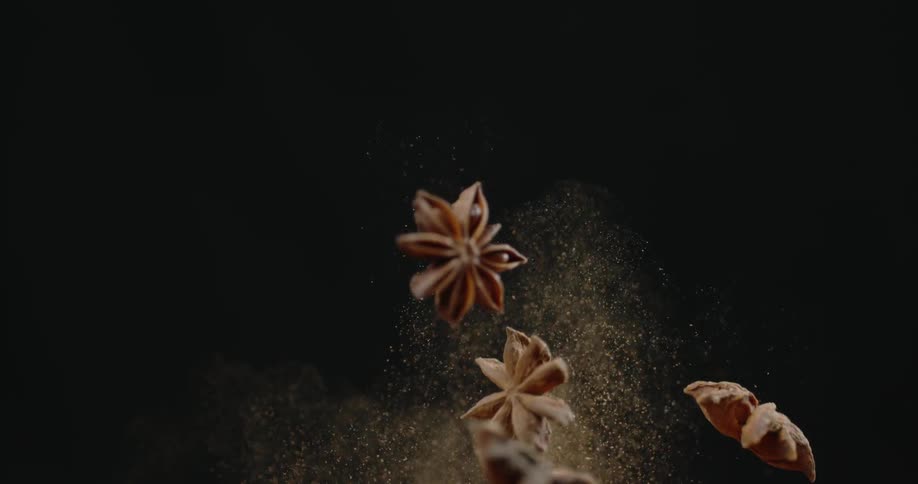 Potpourri make of dried flowers and cinnamon sticks are tossed in the air leaving a cloud of powder