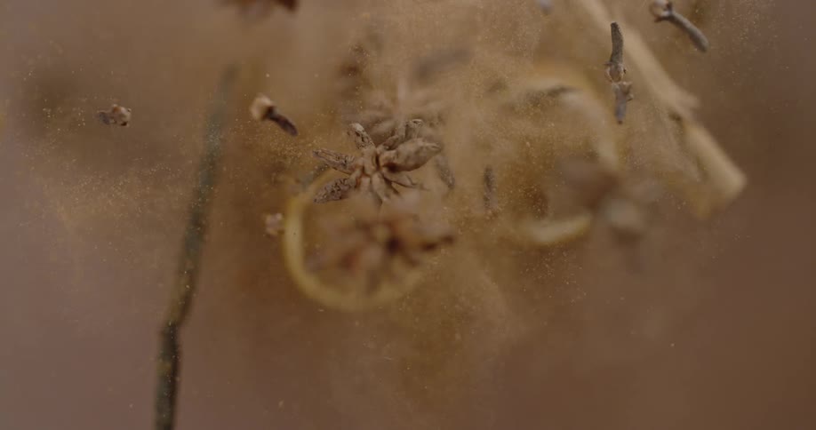 Dried flowers and cinnamon sticks that would be used as potpourri are launched into the air