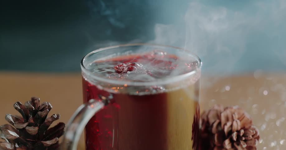 Steam rises from a mug of a hot beverage