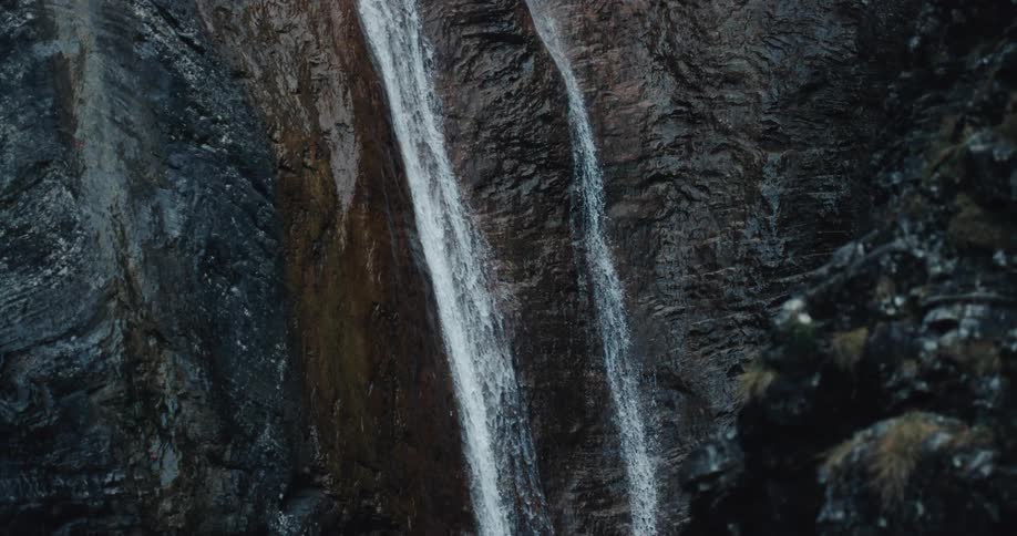 A waterfall running down a very steep cliff