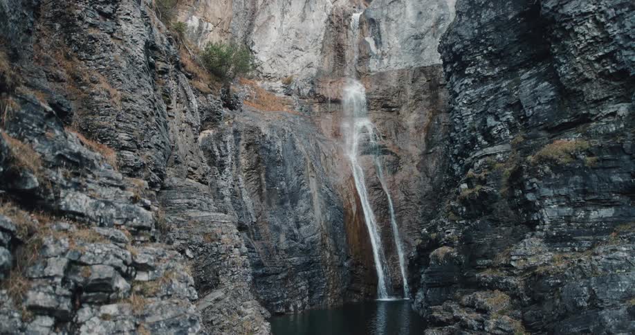 Water falls down the rock formation